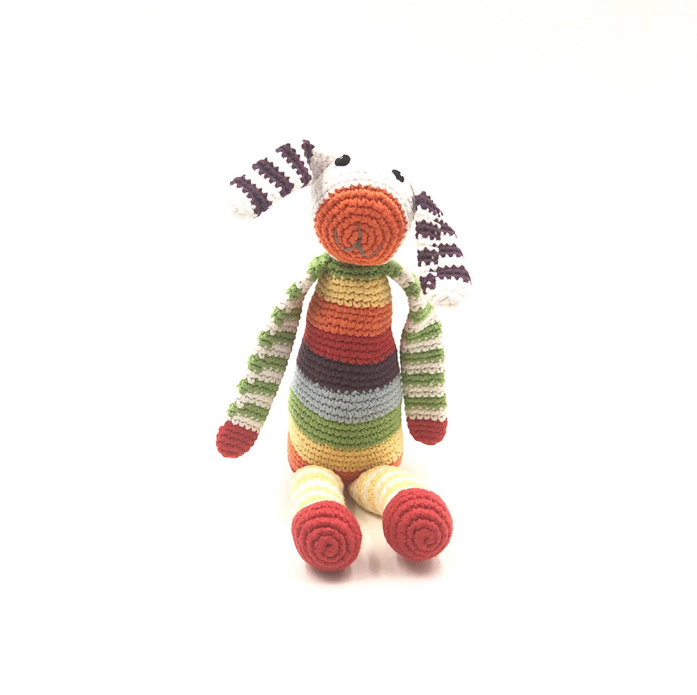 Our floppy-eared, rainbow bunny has to be the brightest rattle in town! Featuring all the colors in our organic cotton range, he’s fun, friendly and fully machine-washable. Hand-knitted