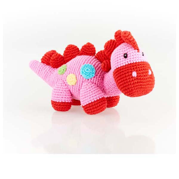 A stegosaurus dinosaur cotton knit toy. Featuring delicate little stitched details, this charming crochet dinosaur has a rattle . Pink Steggy.