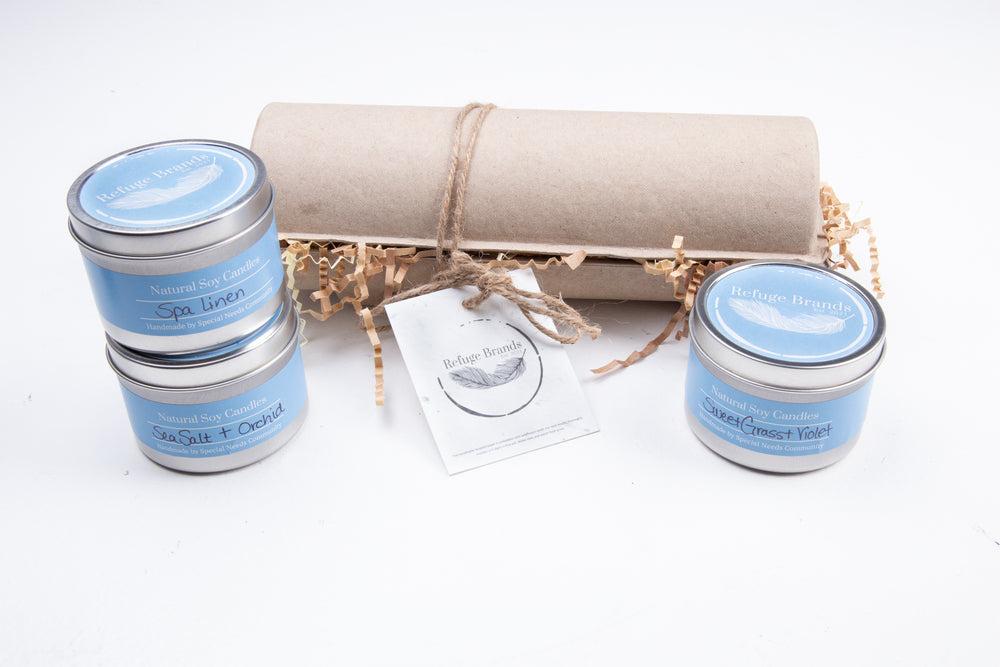 Three large tin candles packaged with seeded brand tag. Gift Set.