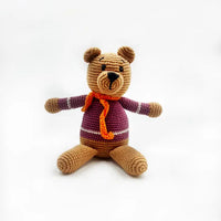 Load image into Gallery viewer, Teddy Bear loves to travel and is happiest when taken on trips and cuddled. This stuffed bear loves new adventures! Handmade with soft cotton yarn, the rattle inside gives a magical jingle when shaken. Hand-knitted in 100% organic cotton + 100% polyester fill. Dimensions: 11&quot;l X 4&quot;w X 3&quot;h. Weight: 8 oz. Soft Purple
