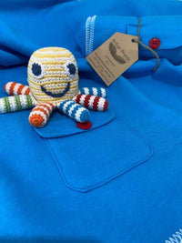 Load image into Gallery viewer, A happy little sea creature is a little hands&#39; favorite! Our organic rainbow octopus rattle is colorful. Shown as part of gift set
