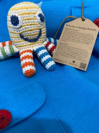 Load image into Gallery viewer, A happy little sea creature is a little hands&#39; favorite! Our organic rainbow octopus rattle is colorful.. Shown as part of gift set.
